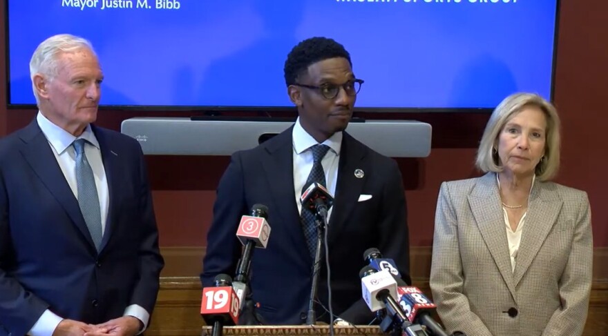 Mayor Justin Bibb announced a settlement deal with Jimmy (left) and Dee (right) Haslam as the owners prepare to move the Browns out of Downtown Cleveland. The Haslams agreed to invest $100 million to city projects and stadium demolition in exchange for city support and dropped law suits over the Brook Park domed stadium.