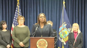 State Attorney General Letitia James (middle) announces a lawsuit against The Villages of Orleans Health and Rehabilitation Center while flanked by relatives of current and former residents of the Albion facility. Photo: screenshot.