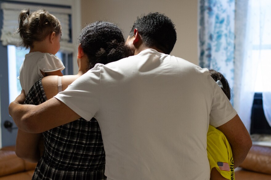 Olman embraces his family, who he was reunited with after spending nine months in an ICE detention center.