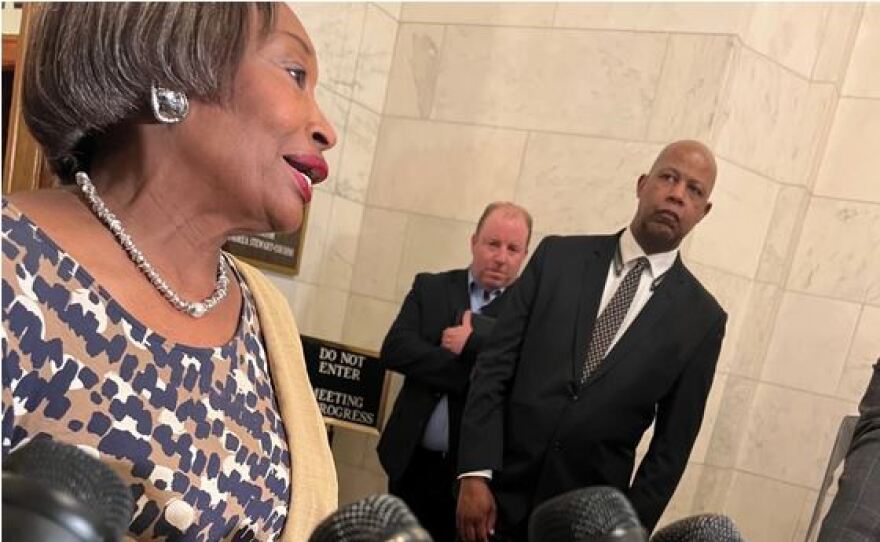 State Senate Leader Andrea Stewart-Cousins with others in the background.