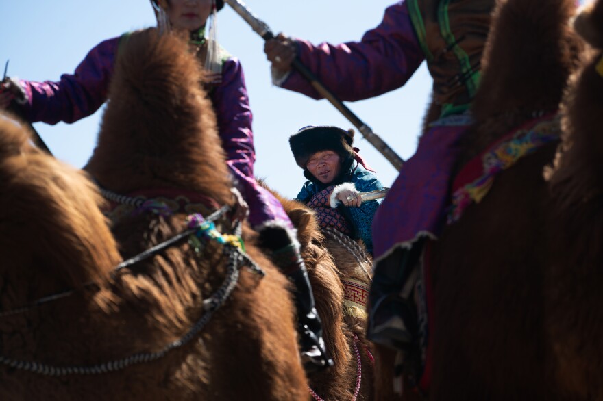 Enkhbaatar waits his turn to promenade in the camel beauty pageant. Lots of pictures are taken, which will allow future generations to have photographic proof of the herders' lifestyle.<strong></strong>