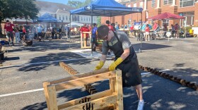 Saturday's bed build in the Kimley-Horn office parking lot resembled an open-air furniture factory.