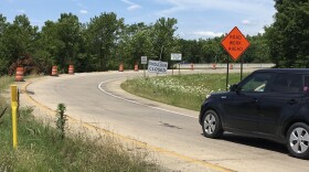 FILE - A motorist prepares to enter a construction area on Interstate 440 in North Little Rock, Ark., June 7, 2017. A half-cent sales tax for highways that voters approved in 2020 is not limited to funding four-lane roads, the Arkansas Supreme Court ruled Thursday, March 16, 2023, clearing the way for the tax to help fund an interstate project in the downtown Little Rock area. (AP Photo/Kelly P. Kissel, File)