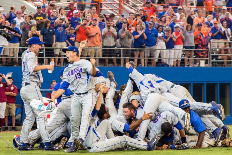 Kirby Snead celebrates Florida's win over FSU with his team on June 6.