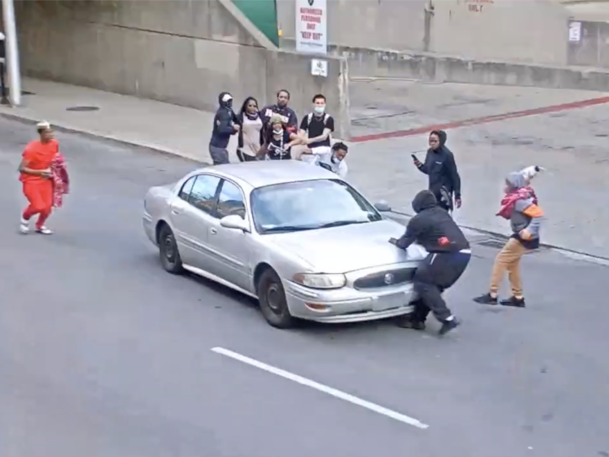 Protesters confront a car in Louisville, Ky. Originally, this photo was erroneously selected to run with the story on attacks on protesters.