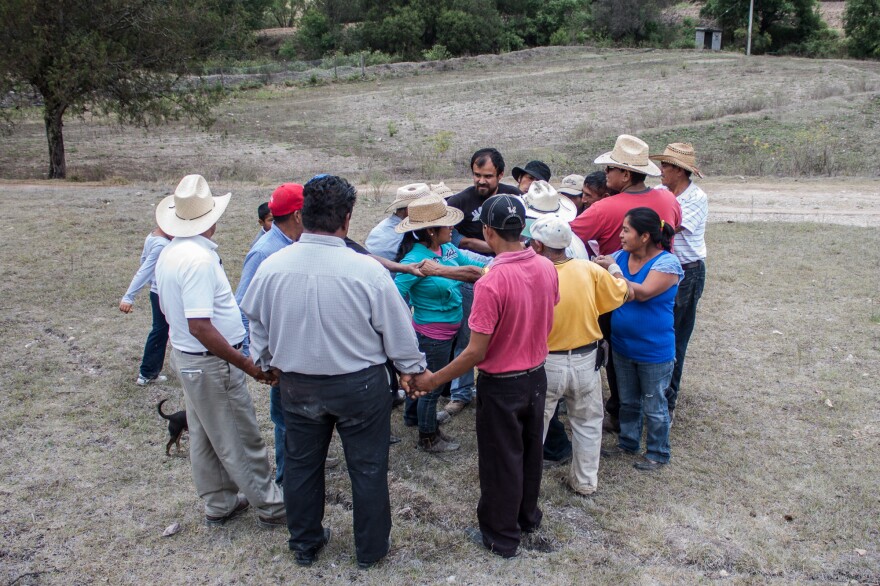 Farmers participate in a trust-building exercise at an organic fertilizer workshop in the Mixteca region of Oaxaca, Mexico. Most of Puente's farmer partners practice what's known as agroecological farming — which prizes maintaining biodiversity — or are "in transition" to these methods.