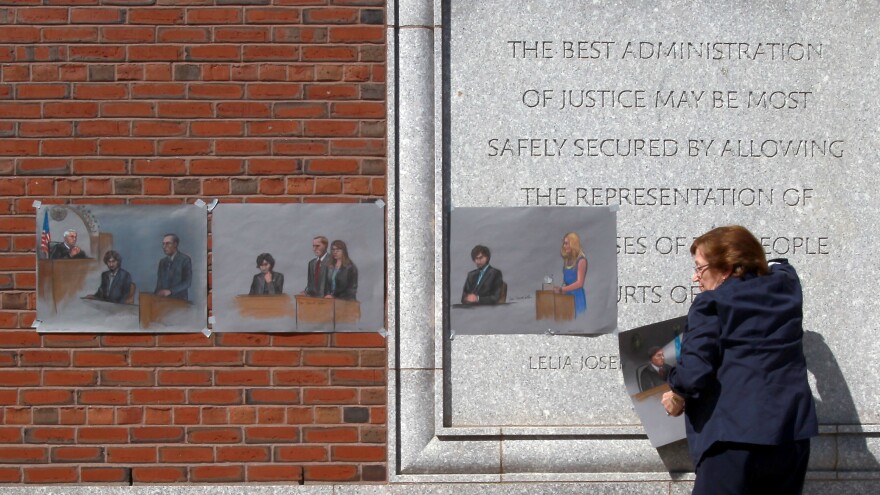 The U.S. Supreme Court will review a lower court's decision from last summer that vacated the death sentence of Boston Marathon bomber Dzhokhar Tsarnaev. Here, atist Jane Flavell Collins pulls down her courtroom sketches outside the Moakley federal courthouse in Boston after Tsarnaev was sentenced. [John Blanding  / Boston Globe via Getty Images]