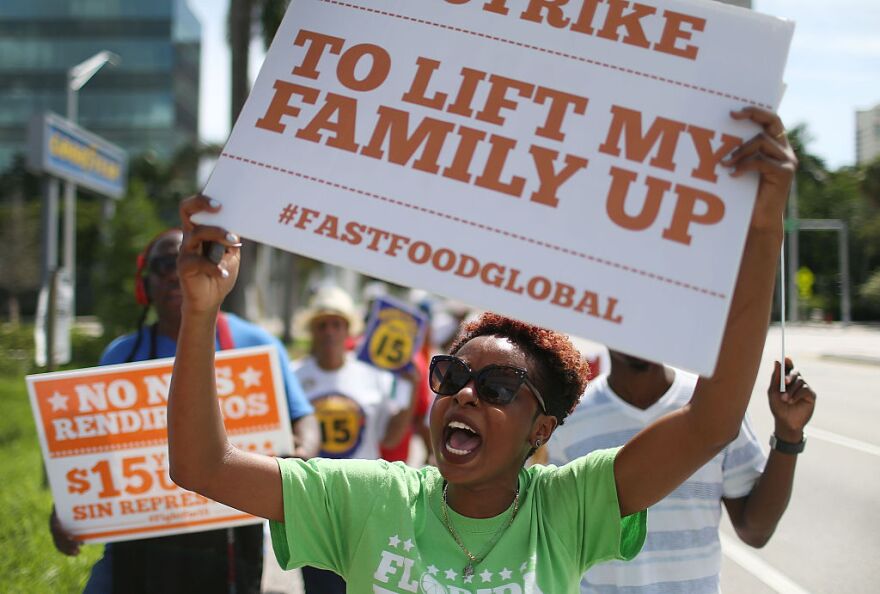 FORT LAUDERDALE, FL - SEPTEMBER 10: Laura Pierre joins with others to protest in support of a $15 an hour minimum wage on September 10, 2015 in Fort Lauderdale, Florida. Seattle, San Francisco and Los Angeles are among cities that have adopted a $15 an hour minimum wages. (Photo by Joe Raedle/Getty Images)