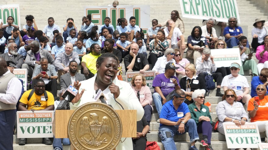 Azia Wiggins, an organizer with Working Together Mississippi, opens the Mississippi Medicaid Expansion Rally at the Mississippi State Capitol in Jackson, with a song, Tuesday, April 16, 2024. (AP Photo/Rogelio V. Solis)