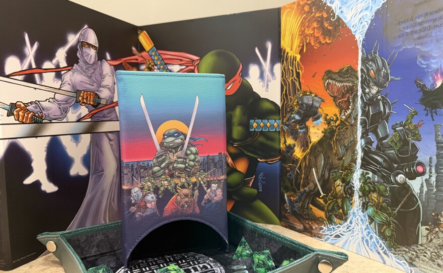 A dice tower featuring characters from "Teenage Mutant Ninja Turtles"