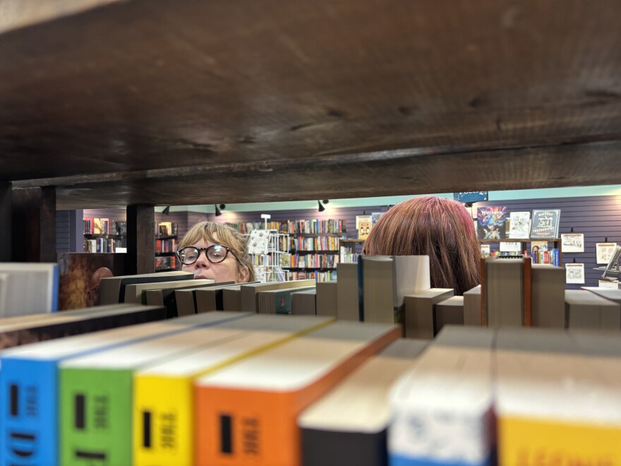 Guests browse the shelves at the Otto Bookstore during a reopening reception Thursday night.