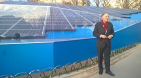 Washington Gov. Jay Inslee, one of the 'super-nationals,' with a solar installation in Paris. 