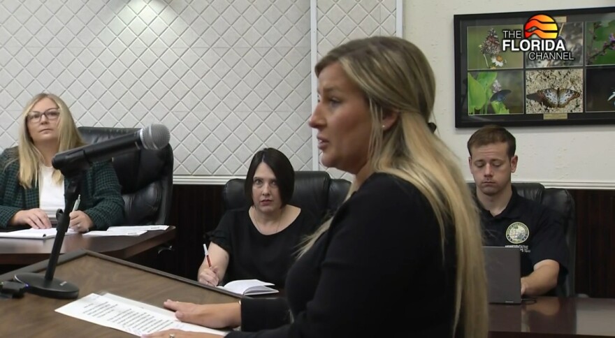 Shawna Beach is at a podium speaking to the Taylor County legislative delegation