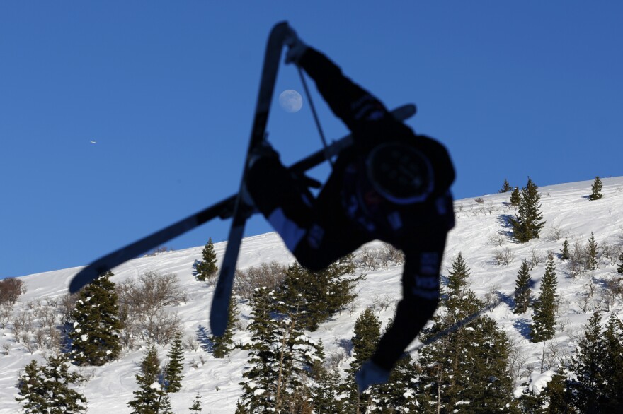 Rasmus Stegfeldt of Sweden trains for the men's moguls World Cup race as the moon rises over the mountains Thursday, Feb. 2, 2023, in Park City, Utah.