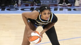 Chicago Sky's Angel Reese looks to pass during the team's WNBA basketball game against the Los Angeles Sparks on Thursday, May 30, 2024, in Chicago. (AP Photo/Charles Rex Arbogast)