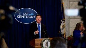 Kentucky Gov. Andy Beshear at the podium during a COVID-19 memorial service at the State Capitol in Frankfort on Nov. 14, 2021.