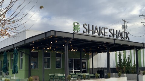 A building in a parking lot. 