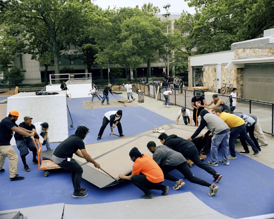 The Underground Never Dies crew and BMX community moving a ramp on "It's my Park Day," 2016.