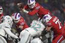 Buffalo Bills quarterback Josh Allen (17) dives for a two-point conversion during the second half of an NFL football game against the Miami Dolphins in Orchard Park Dec. 17, 2022.
