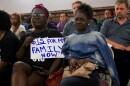 Supporters of raising St. Louis' minimum wage listen to testimony Tuesday at St. Louis City Hall.