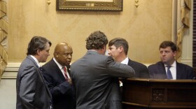 South Carolina state senators talk to cartographers that helped draw the Senate's 46 new districts on Tuesday, Dec. 7, 2021, in Columbia, S.C. The Senate approved the new maps on a 41-2 vote. (AP Photo/Jeffrey Collins)