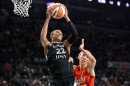 Las Vegas Aces center A'ja Wilson (22) pulls down a rebound by Indiana Fever guard Lexie Hull (10) during the first half in Game 3 of an WNBA basketball first-round playoff series Thursday, Oct.1, 2026, in Las Vegas. (AP Photo/Steve Marcus)