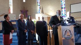 St. Louis Circuit Attorney Kim Gardner, left, listens as the Rev. Phillip Duvall addresses the importance of diversion programs on Jan. 30, 2019.