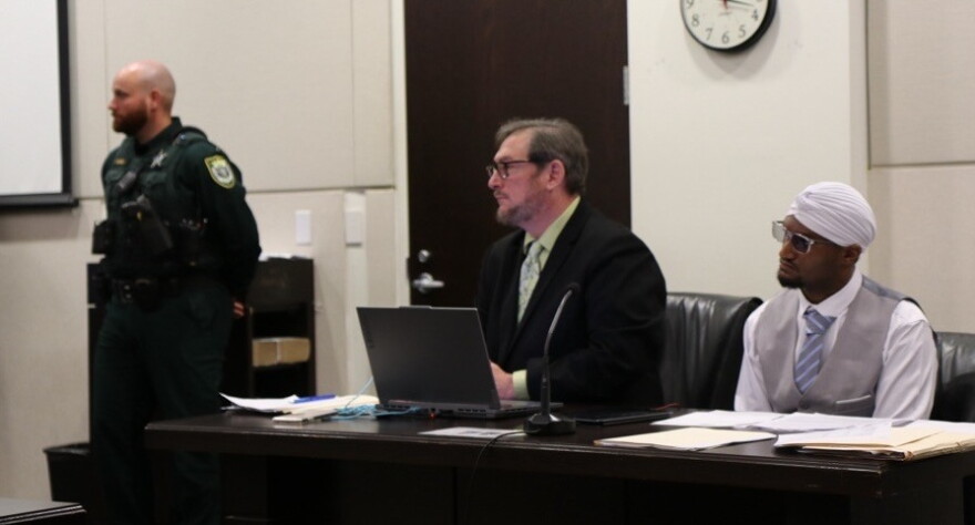 Blake Jackson, right, sits beside his attorney, Geoffrey Mason, as Ian “Bob” Munnerlyn testifies. Jackson and Munnerlyn knew each other growing up in Hawthorne. (Katie Klaiber/WUFT News)