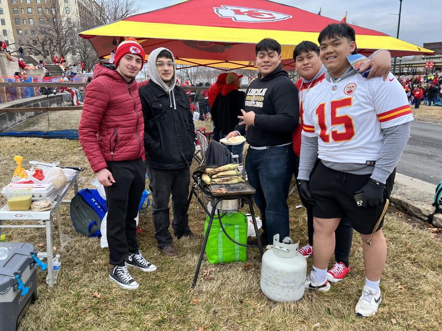 Mohaimin Alwaely, second from left, and his friends grilled corn and steak for breakfast Wednesday morning. All are students at Lincoln College Preparatory Academy.