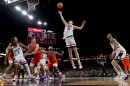 UConn guard Braylon Mullins (24) rebounds against Illinois during the second half of an NCAA college basketball game.