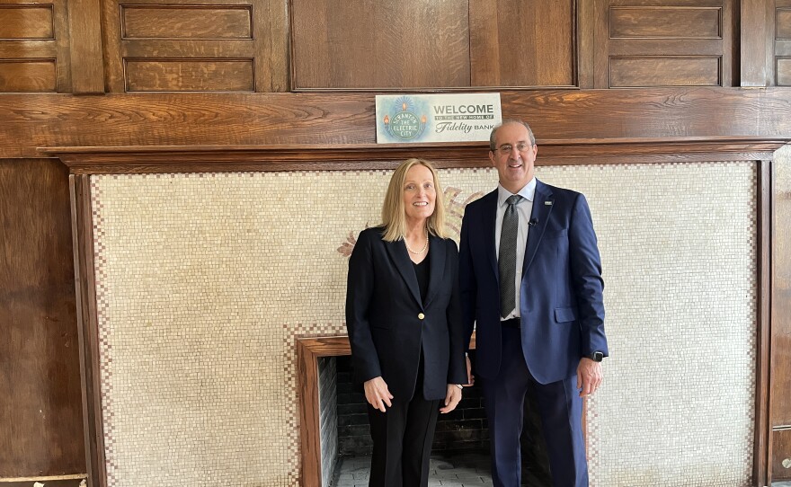 Fidelity Bank's Ruth Turkington, Executive Vice President and Chief Consumer Banking Officer, left, and Daniel Santaniello, president, stand near a fireplace in Santaniello's future office in the Scranton Electric Building.