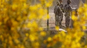 Texas National Guard members stand guard on the banks of the Rio Grande in El Paso in 2023.