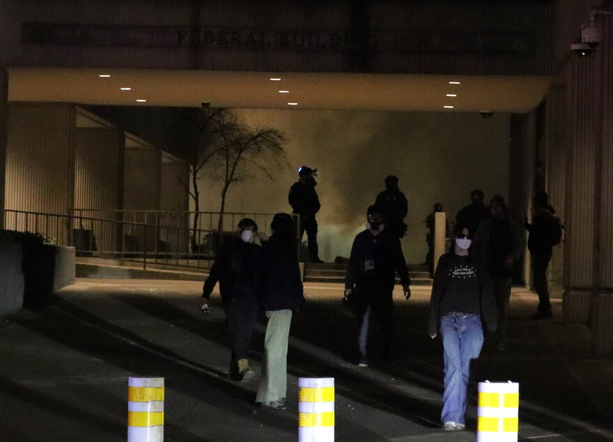 Law enforcement deploys tear gas at the Eugene Federal Building, Jan. 30, 2026.