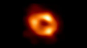 In this handout photo provided by NASA,  This is the first image of Sgr A*, the supermassive black hole at the centre of our galaxy, with an added black background to fit wider screens.
