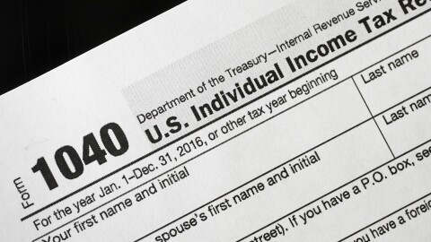 FILE - I this Jan. 10, 2017 file photo, a 1040 tax form appears on display in New York. Last year the IRS issued 111 million refunds, with an average refund of $2,860. More than 70 percent of taxpayers will get refunds this year, the IRS estimates.