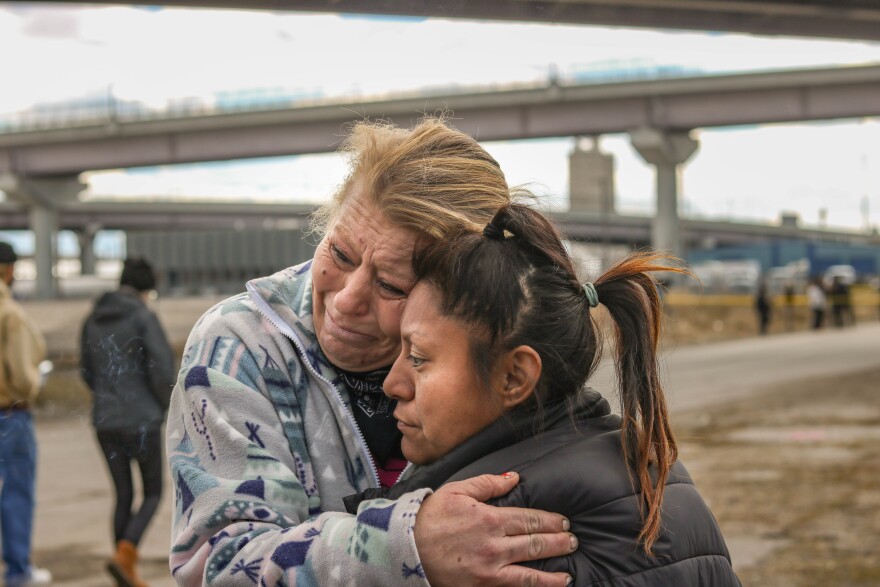 Stacey Johnson and Savannah Reed embrace at the camp abatement at the Fort Pioneer Camp in Salt Lake City. Johnson said was worried she would be arrested and didn't know where her husband and two dogs would go.