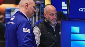 Specialists Philip Finale, left, and Meric Greenbaum work on the floor of the New York Stock Exchange, Friday, May 29, 2026. (AP Photo/Richard Drew)