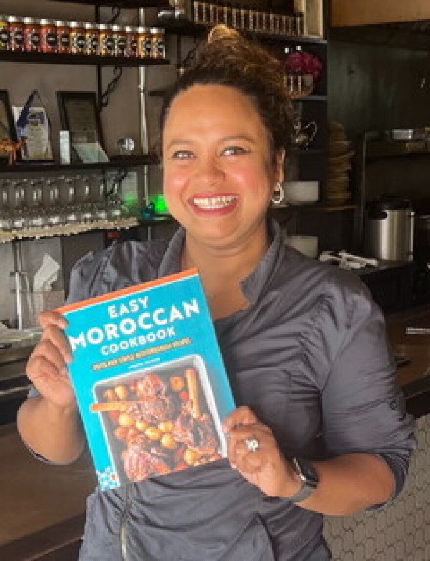 Waheed with her cookbook of Moroccan recipes