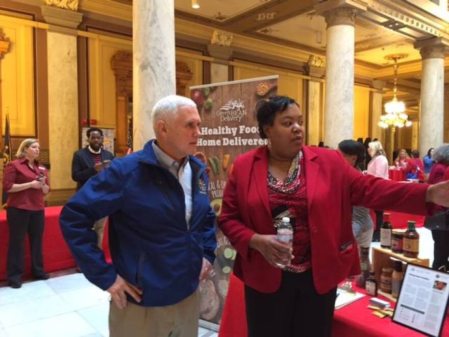 Governor Pence and Danielle Patterson check out the AHA spread at the Statehouse.