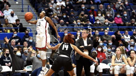 Geno Auriemma watches Christyn Williams #13 airborne for a save in the UConn Huskies win over the Georgetown Hoyas at the XL Center In Hartford, Connecticut February 19, 2022.