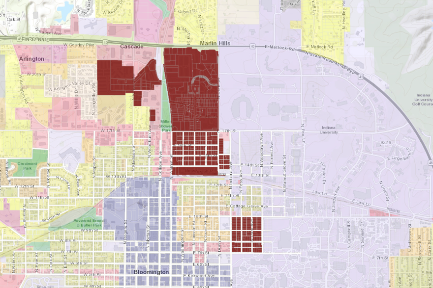 The areas in red indicate the three districts zoned for student housing as the blue area represents downtown Bloomington.