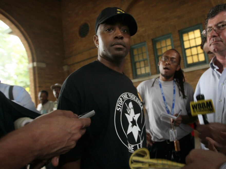Jim Allen, 32, who says he's been a member of the Vice Lords, speaks with reporters after a news conference. Allen says Chicago's pilot strategy to curb gang-related violence on the city's west side will have an impact, as gang leaders are fearful of tougher federal charges they may face as a result.