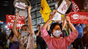 Filipino activists bang pots and pans as they take part in a global noise barrage rally against the coup in Myanmar on in Manila. These protests join those in the streets of Myanmar.