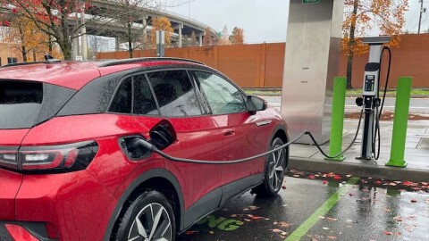 An electric vehicle is charging at Oregon Museum of Science and Industry's parking lot, Nov. 11, 2024. The Oregon Department of Environmental Quality has reopened a popular rebate program to make it easier for households to afford zero and low emission vehicles.