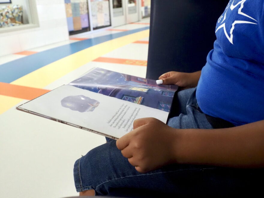 A fifth grader reads a book at Positive Tomorrows school in Oklahoma City on Aug. 17.