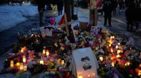 A makeshift memorial honoring Renee Good, who was fatally shot by an ICE officer the day before, is seen near the site of the shooting in Minneapolis, Thursday, Jan. 8, 2026. (John Locher/AP)
