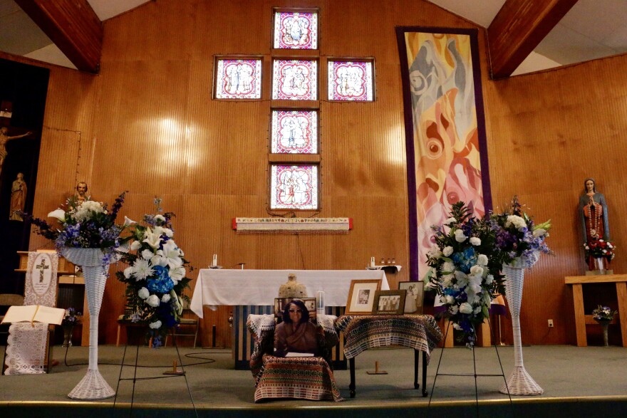 Blanche Jacobs' ashes sit at the Immaculate Conception Catholic Church in Bethel, surrounded by images her family provided. 