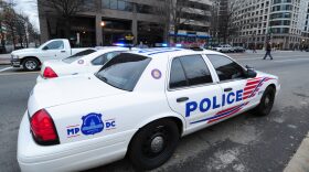 Washington, DC police cruisers parked on K Street at the Occupy encampment in McPherson Square.