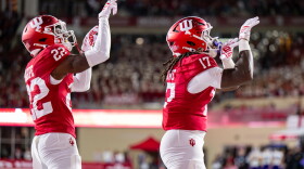 Indiana defensive back Jamari Sharpe (22) and defensive lineman Daniel Ndukwe (17) react after scoring a safety against Northwestern during the first half of an NCAA college football game, Friday, Sept. 25, 2026, in Bloomington, Ind. (AP Photo/Doug McSchooler)