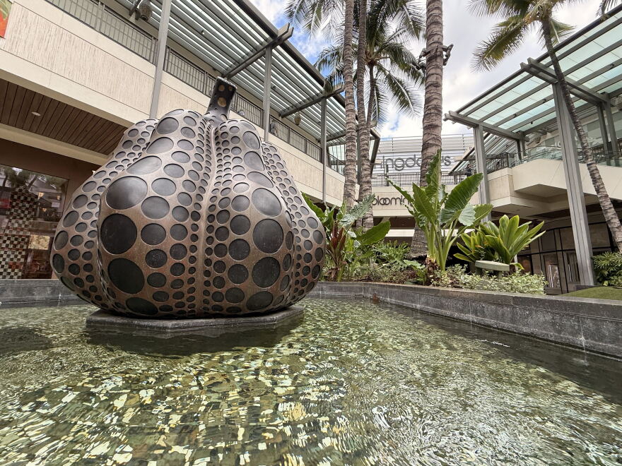 About 6 feet high and situated in pool of water, a bronze pumpkin sculpture by Yayoi Kusama is seen at Ala Moana Center in Honolulu.